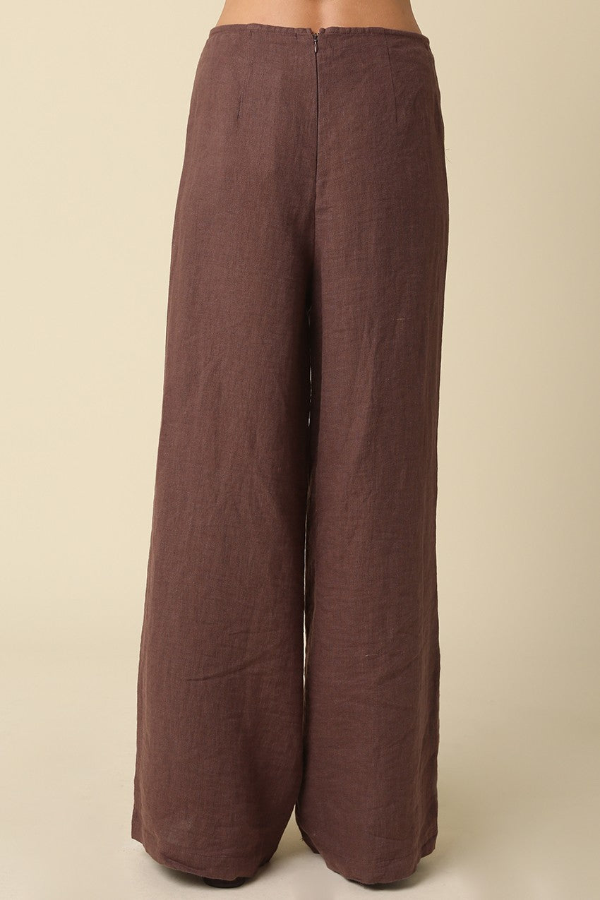 Brown wide-leg pants on a beige background