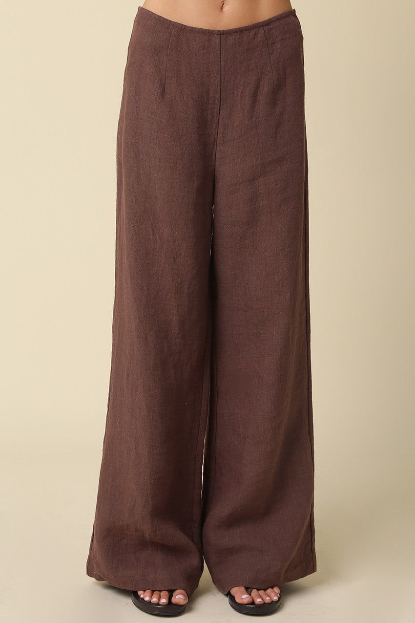 Brown wide-leg pants on a beige background