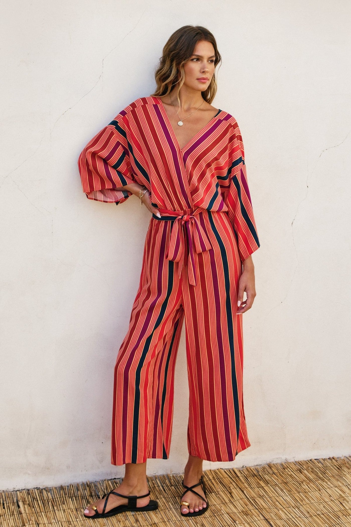 DRESS FORUM STRIPED KIMONO SURPLICE JUMPSUIT – A STRIPED ONE-AND-DONE LOOK WITH KIMONO SLEEVES AND A CINCHED WAIST