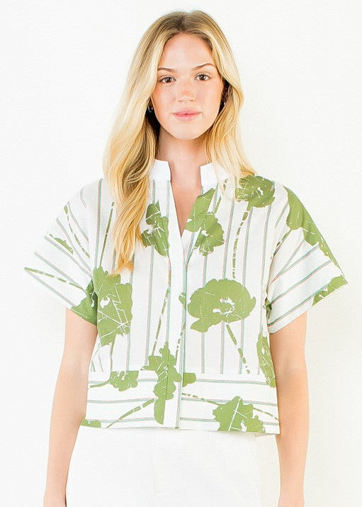 White short-sleeve top with green botanical print and vertical stripes, button-front closure.